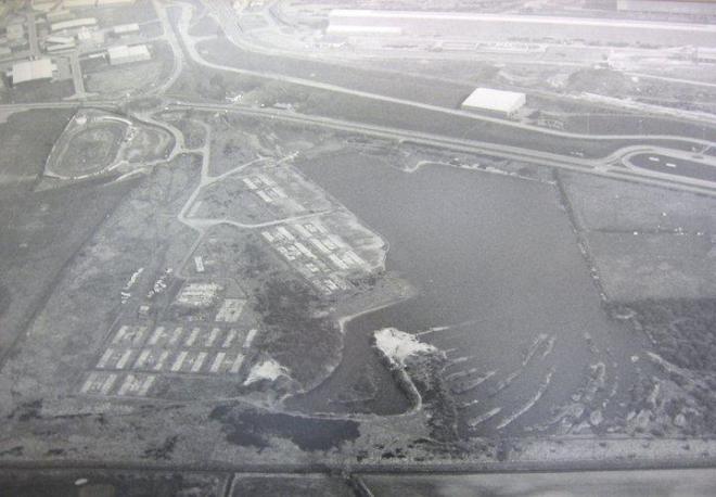 Anchor Village in the mid 1980s. After the steelworks Anchor project was complete in the mid 1970s the village became unused and slowly became dilapidated, the nearby lake often flooded the lower  accommodation units.