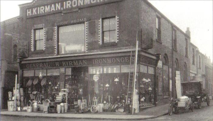 Kirmans Market Hill shop with the company motorbike & sidecar and truck outside.